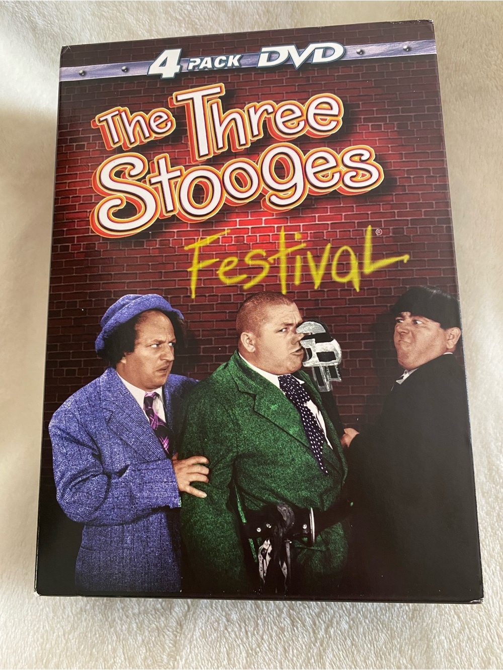 The Three Stooges Festival - 4 Pack DVD (Green, Purple, Black)